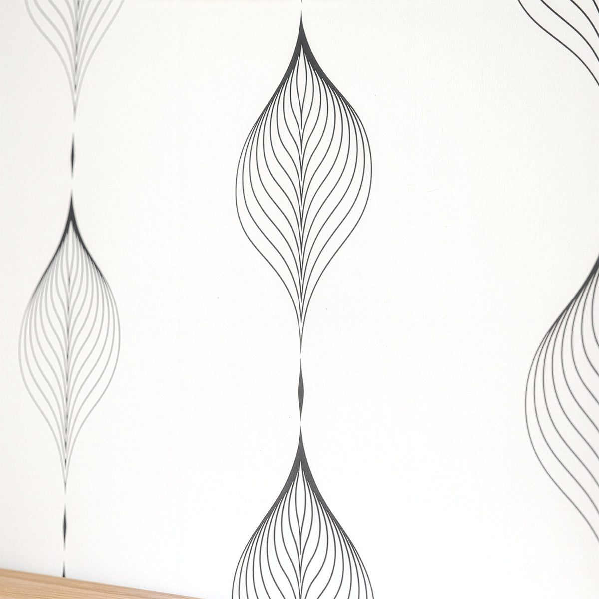 Minimal leaf wall decals shown in a styled bedroom interior