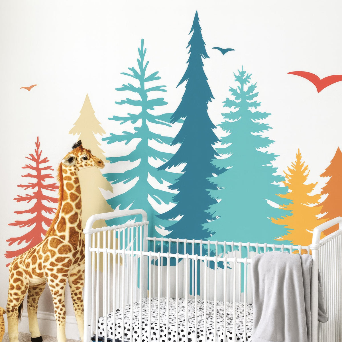 Scandinavian pine forest wall decal set installed in a styled nursery