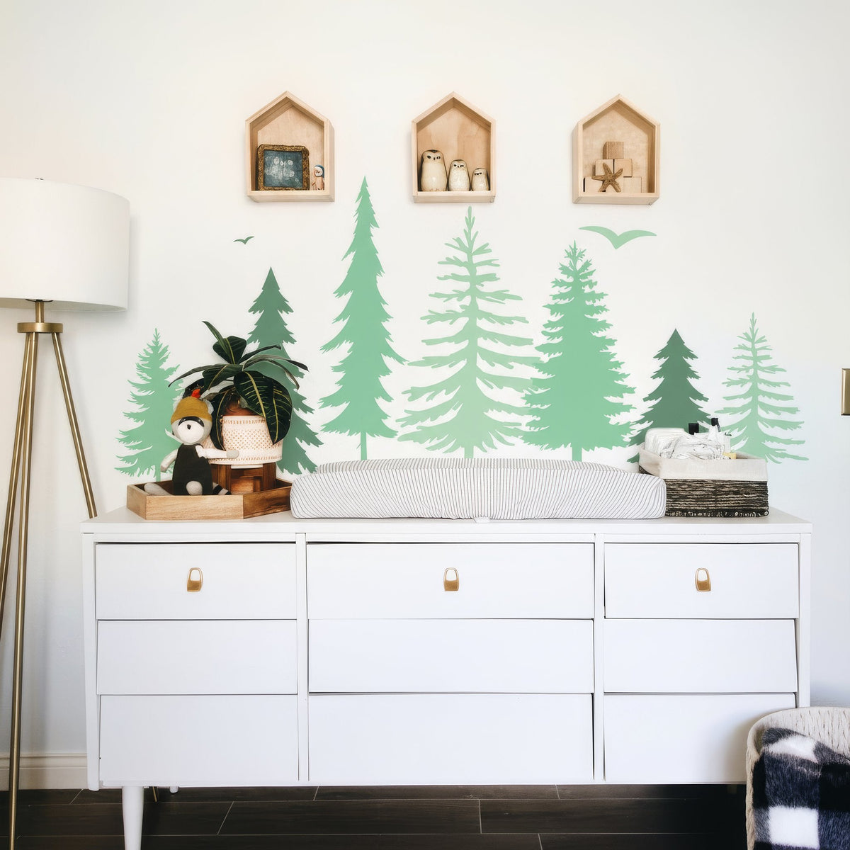 Pine forest wall decals shown in a children's reading corner