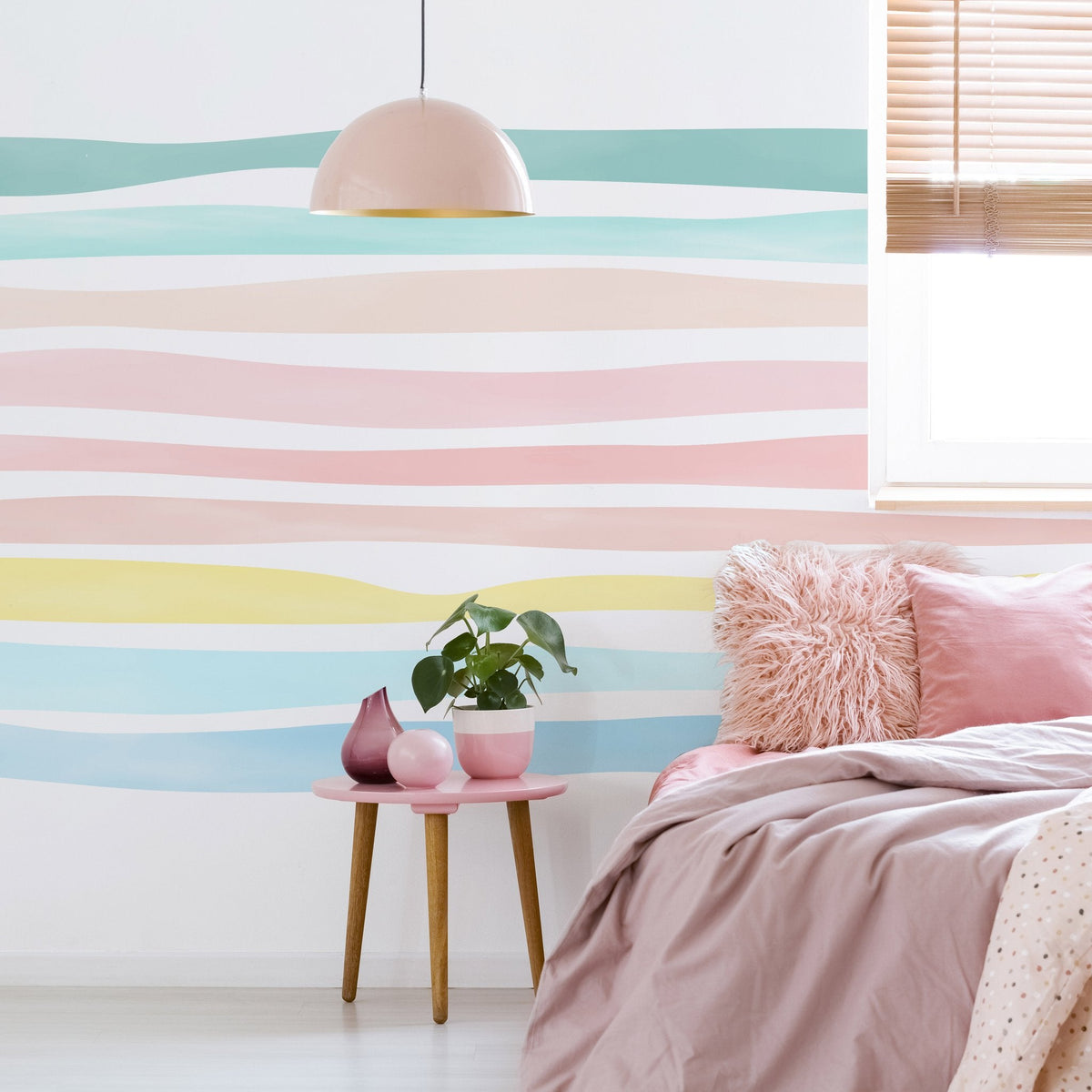 Watercolor stripe wall decals installed on a pastel nursery accent wall with soft painted horizontal bands