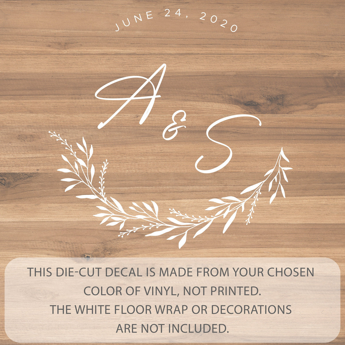 Botanical Crest Monogram Dance Floor Decal for Wedding shown at a wedding reception