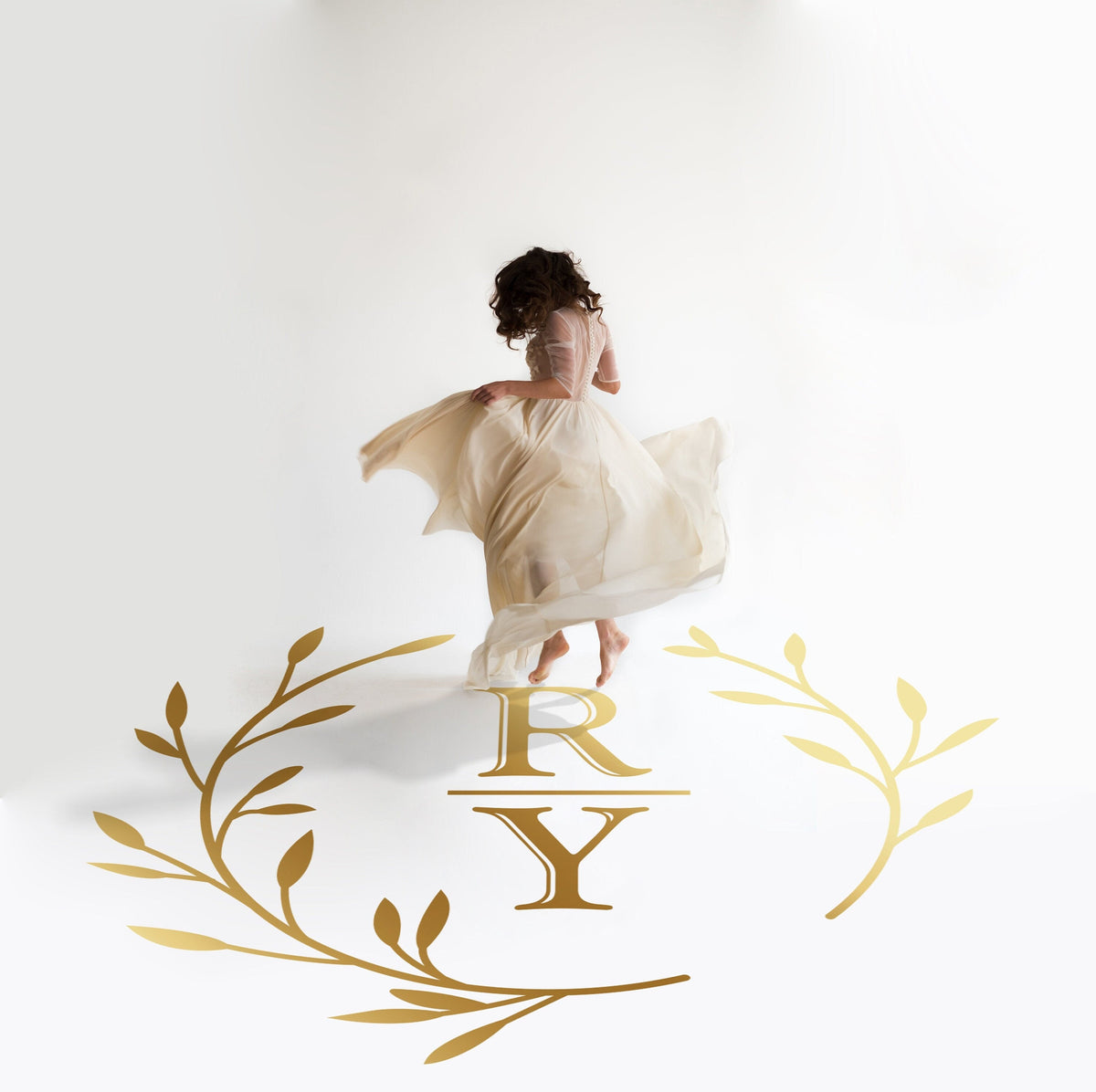 Divided Initials Wreath Dance Floor Decal for Wedding in gold on a white wedding dance floor