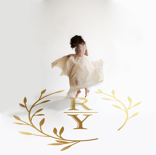 Divided Initials Wreath Dance Floor Decal for Wedding in gold on a white wedding dance floor