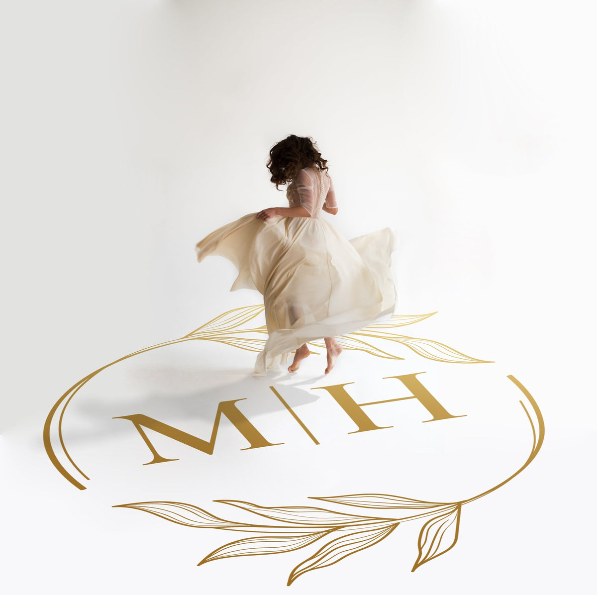 Fine Line Hoop Monogram Dance Floor Decal for Wedding in gold on a white wedding dance floor