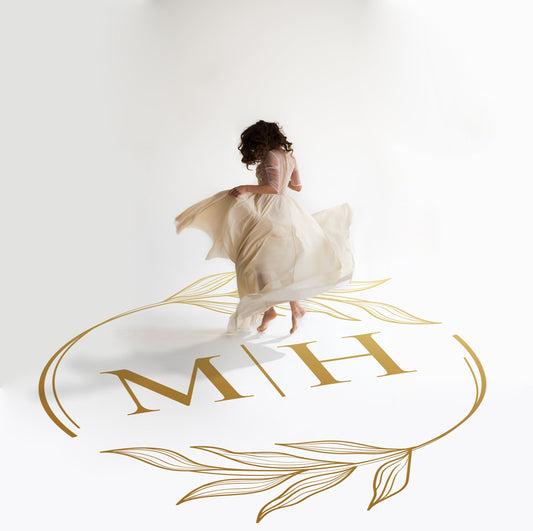Fine Line Hoop Monogram Dance Floor Decal for Wedding in gold on a white wedding dance floor