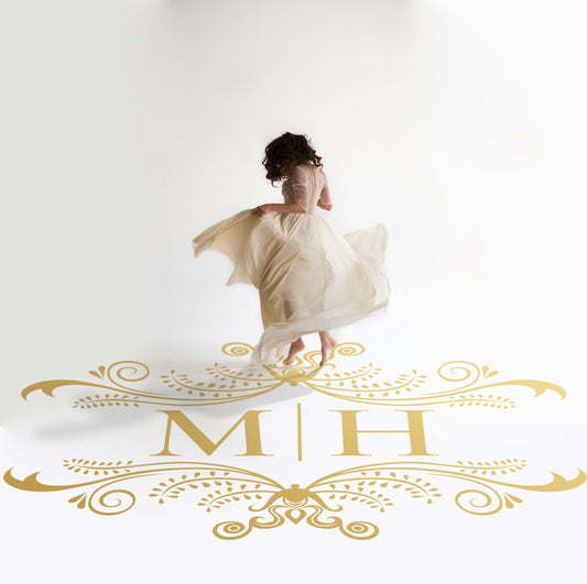 Whimsical Curl Monogram Dance Floor Decal for Wedding in gold on a white wedding dance floor