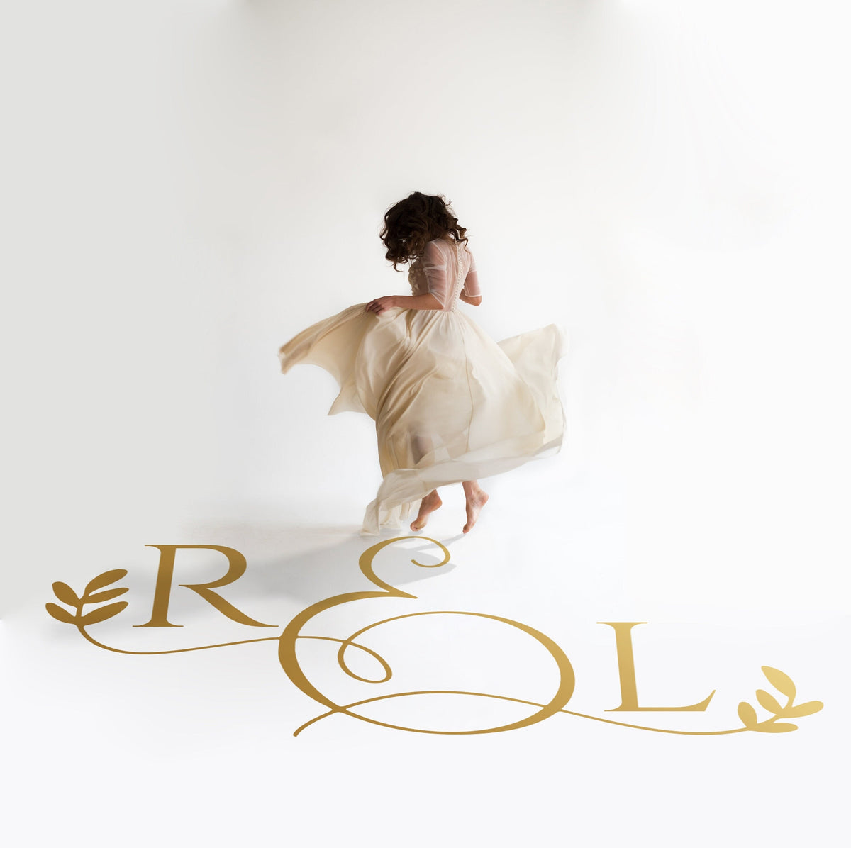 Swirl Ampersand Initials Dance Floor Decal for Wedding in gold on a white wedding dance floor
