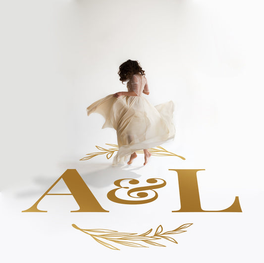 Bold Ampersand Initials Dance Floor Decal for Wedding in gold on a white wedding dance floor