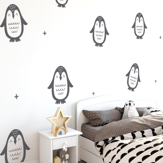 Penguin Wall Decals Set (12 Large Penguins 9-12") installed on a styled nursery wall