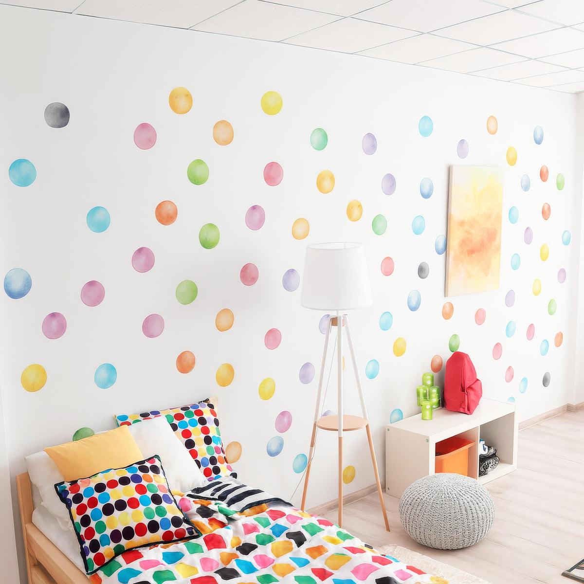 Rainbow Watercolor Polka Dot Wall Decals (3 Inch Dots) arranged on a feature wall