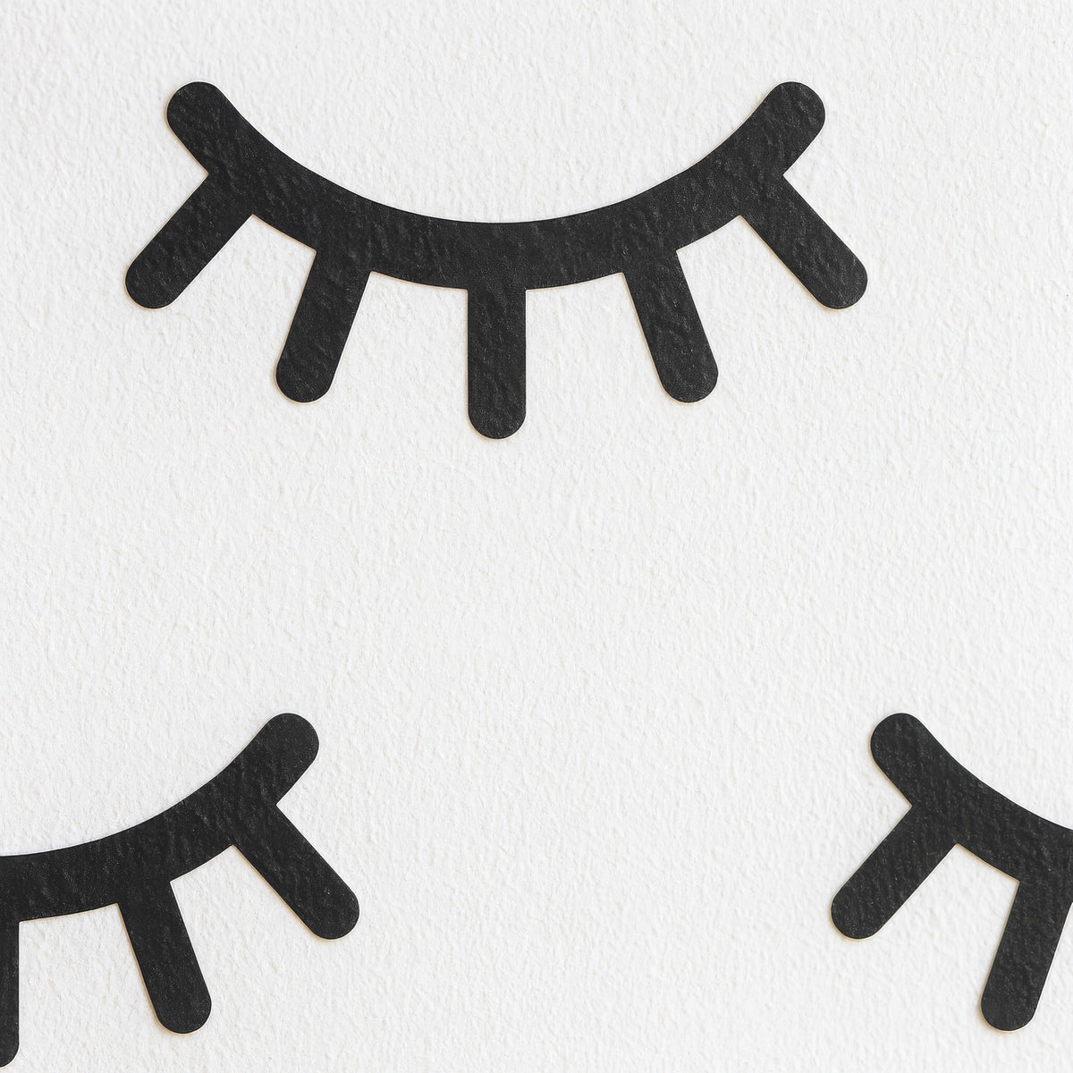 Eyelash Wall Decals Set (70 or 140) arranged on a feature wall