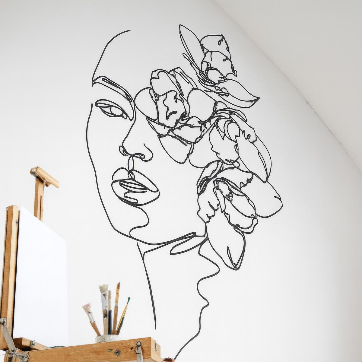 Minimalist Floral Face Wall Decal styled in a room setting