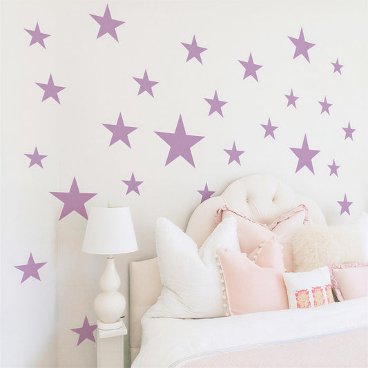 Star Wall Decals Set (20pcs) installed on a styled wall