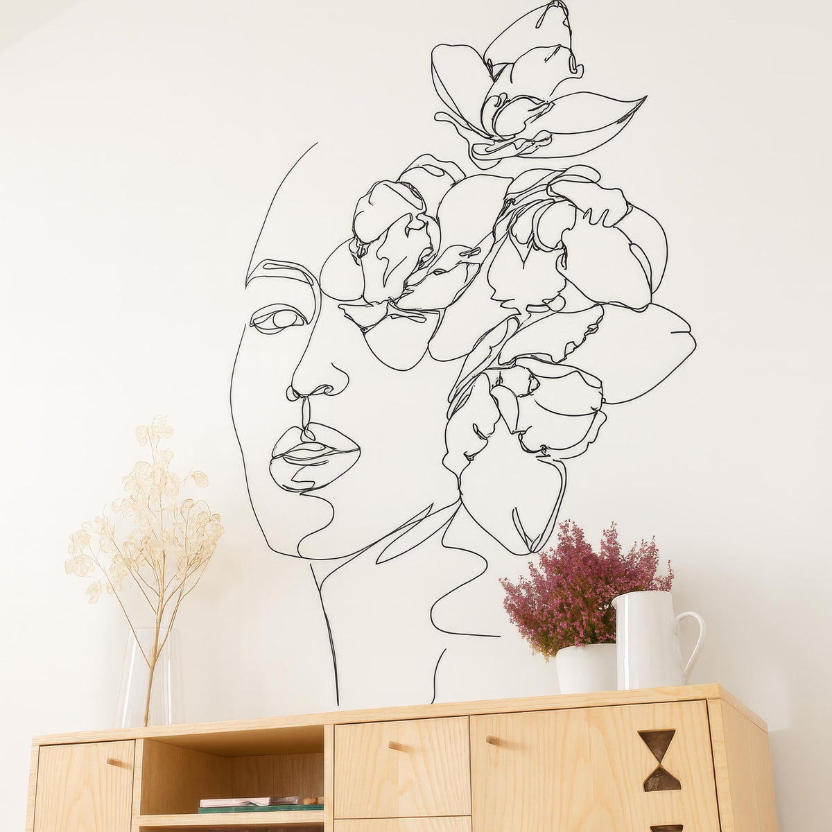 Minimalist Floral Face Wall Decal installed on a styled wall