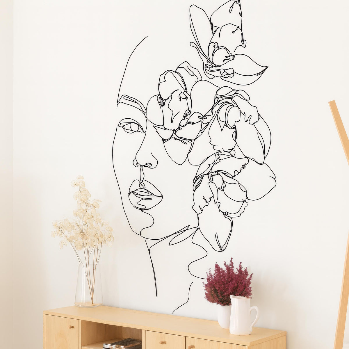 Minimalist Floral Face Wall Decal shown in a home interior