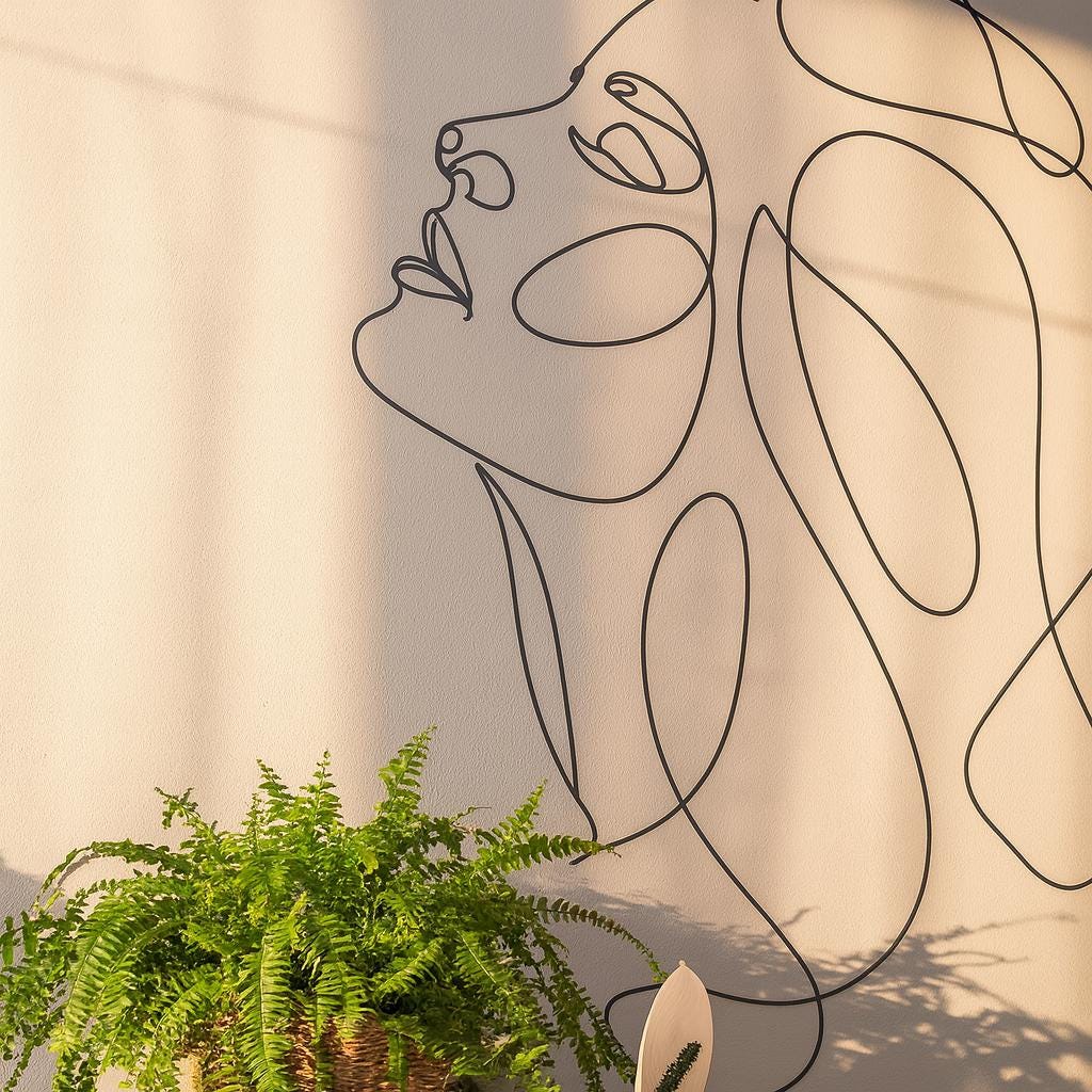 Woman Face Wall Decal shown in a home interior