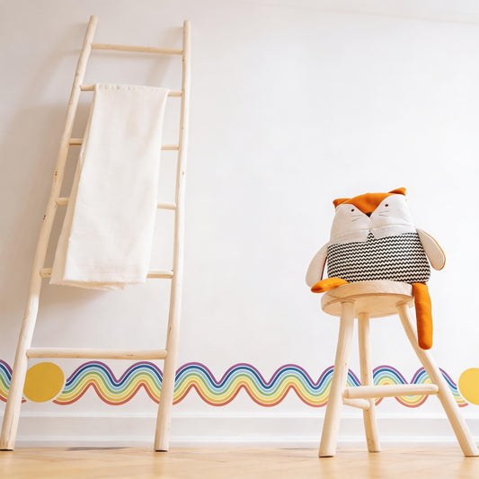 Rainbow Wall Decal Border installed on a styled wall