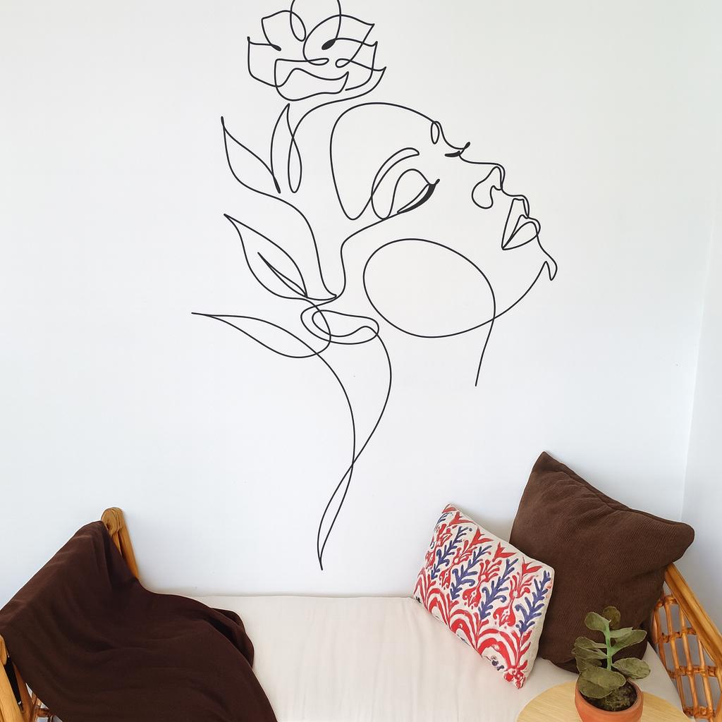 Woman Face Wall Decal arranged on a feature wall