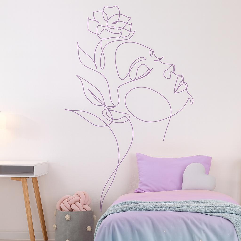 Woman Face Wall Decal displayed in a styled space