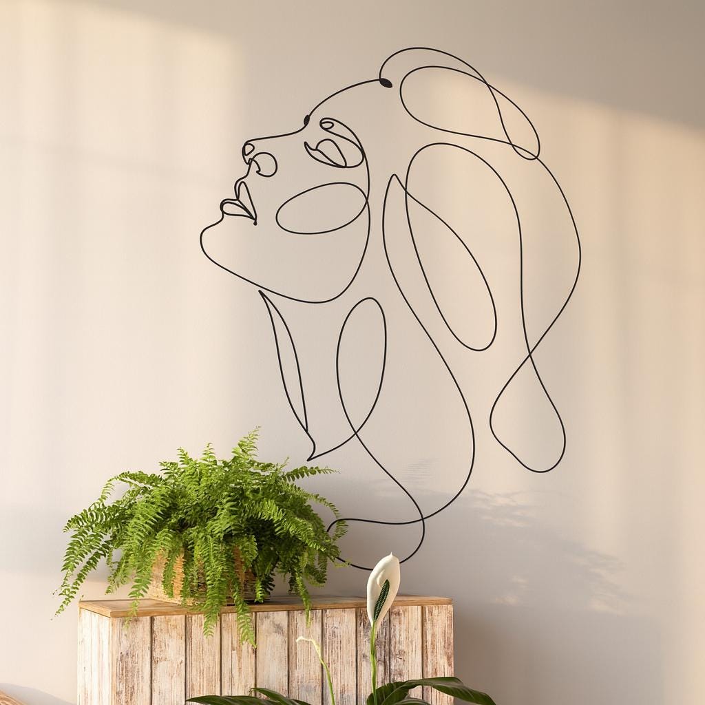 Woman Face Wall Decal installed on a styled wall