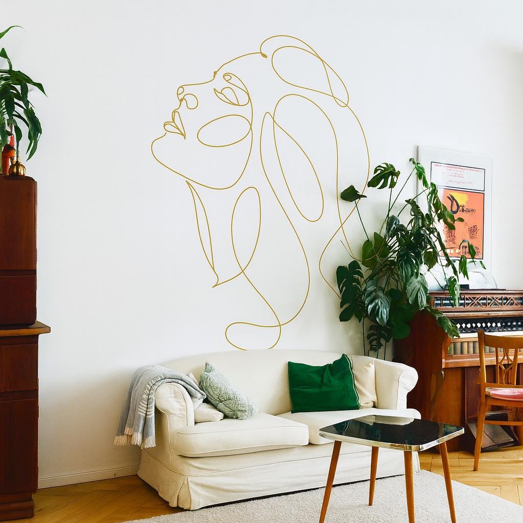Woman Face Wall Decal displayed in a styled space